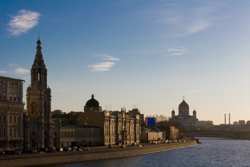 sunset, quay of  river with chuches and temple in