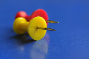 yellow and red push pins