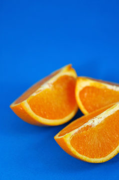 orange wedges over blue background