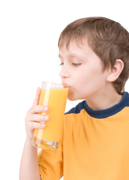 young boy with orange juice