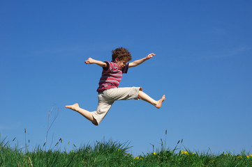 young boy jumping