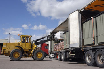 forklift loading a truck