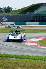 Foto op Plexiglas racewagen op het circuit © Mayonaise