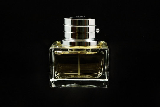 Bottle Of Perfume Over Black Background