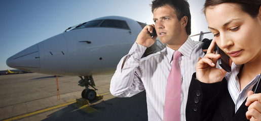 businesspeople and corporate jet