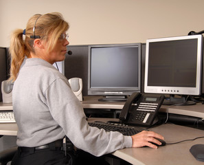 police dispatcher working at console