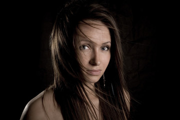 Fototapeta premium beautiful young woman with flying hair