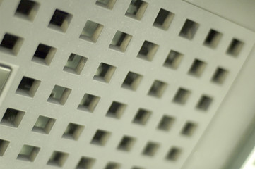 square holes in white plastic plate