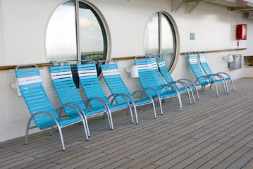 blue-green deck chairs on cruise ship