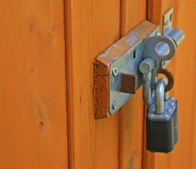 padlock and shootbolt on a garden shed