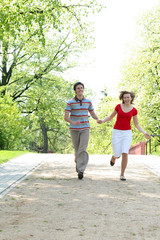 Fototapeta premium couple running in a park