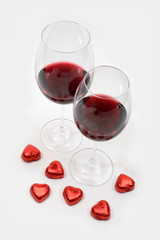 two goblets with red wine