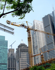 some cranes in a building site