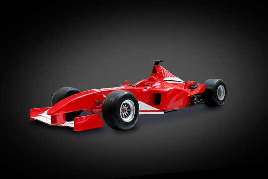 red formula one car in black background