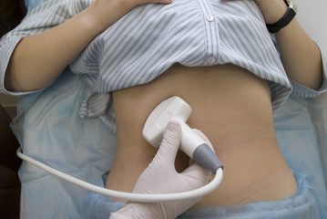 scanning of a stomach of the pregnant woman