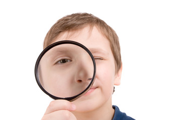 young boy with magnifying glass