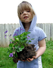 girl holding plant
