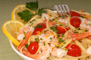 bowl of lemon pasta with shrimp and tomatoes