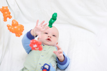 baby playing with toys. little boy touching the toy by finger.