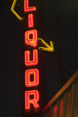 red neon liquor store sign