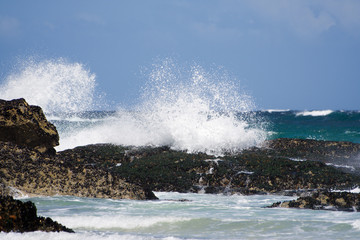 wave breaks on rocks