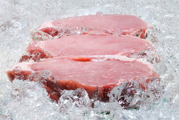 fresh pork on board ready to cook ice storage