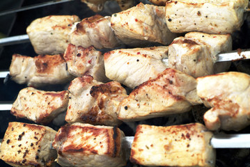 pork on the grill at a cookout