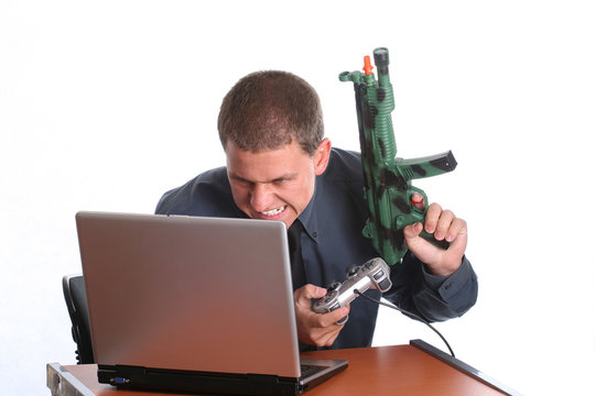 young businessman playing on laptop