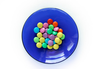 multi-coloured goodies on blue plate
