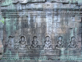 sculture of khmer art in old stone,  ta prohm, bayon, angkor tem