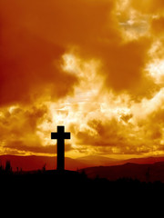 cross  silhouette in high mountain
