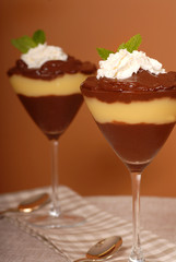 chocolate and vanilla puddings in martini glasses