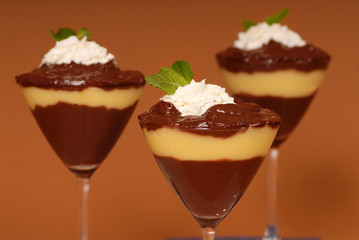 three chocolate and vanilla puddings