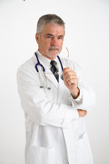 doctor holding eye glasses looking concerned