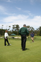 elderly group golfing