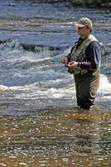fisher in river