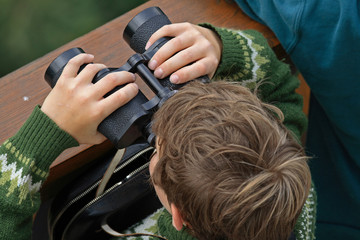 child and binoculars