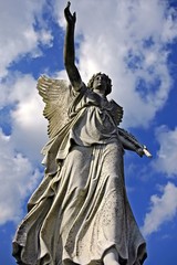 Fototapeta premium angelic victory statue on the sky background