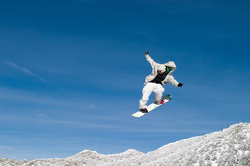 Naklejka na ściany i meble snow boarder high in the air zoom