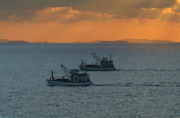 fishing boats at sunrise