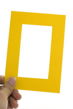 hand holding a yellow frame