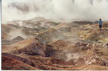 water hot geysers with smoke and steam, uyuni desert, bolivia