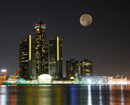 city skyline under moonlight