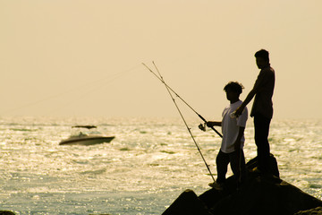 Fishermen on rocks