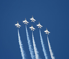a fighter formation at an air show