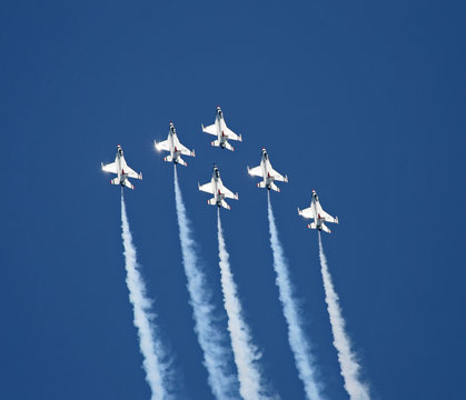 a fighter formation at an air show