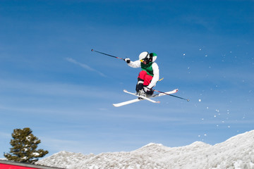 Naklejka na ściany i meble skier high in the air cross feet