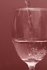 pouring wine into glass