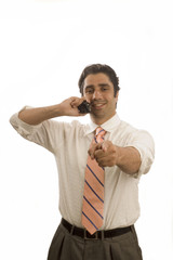 young executive on phone pointing