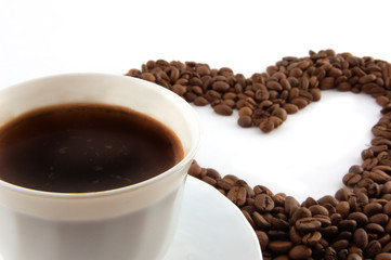 cup of coffee with heart of coffee beans